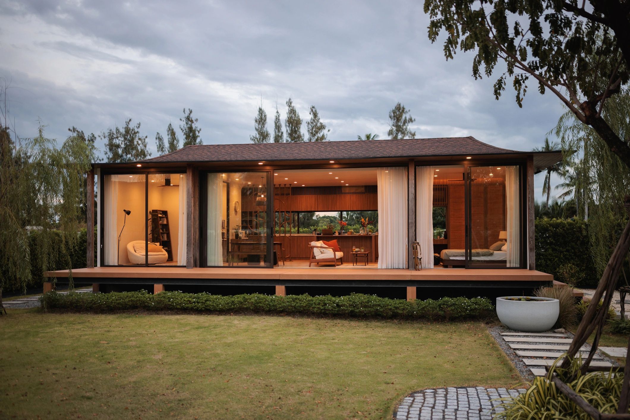 Modern homestay exterior at dusk
